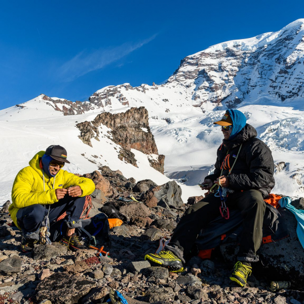Zahan Billimoria and Ben Hoiness in our open bivy at the foot of Liberty Ridge on Mt Rainier,  WA. Hyper Puff, 7th grade Parka, sleeping bag